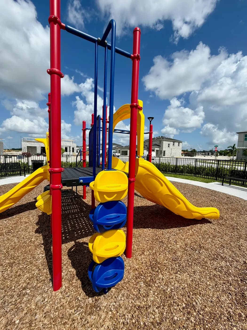 Overhead climber and yellow slide on the Acacia Groves playground