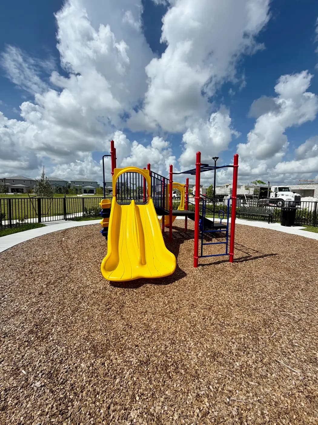 Twin yellow slides on the Acacia Groves playground