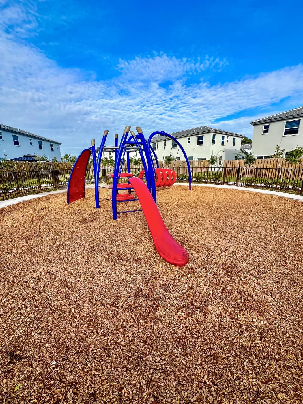 Arched loop climbing course with a red slide