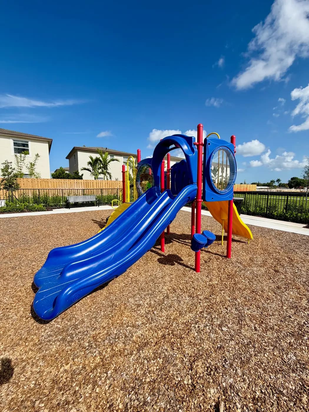 Blue slide and red posts at the Coral Landings playground