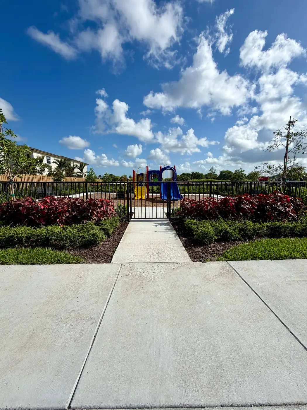 Walkway and gate to the fenced Coral Landings playground