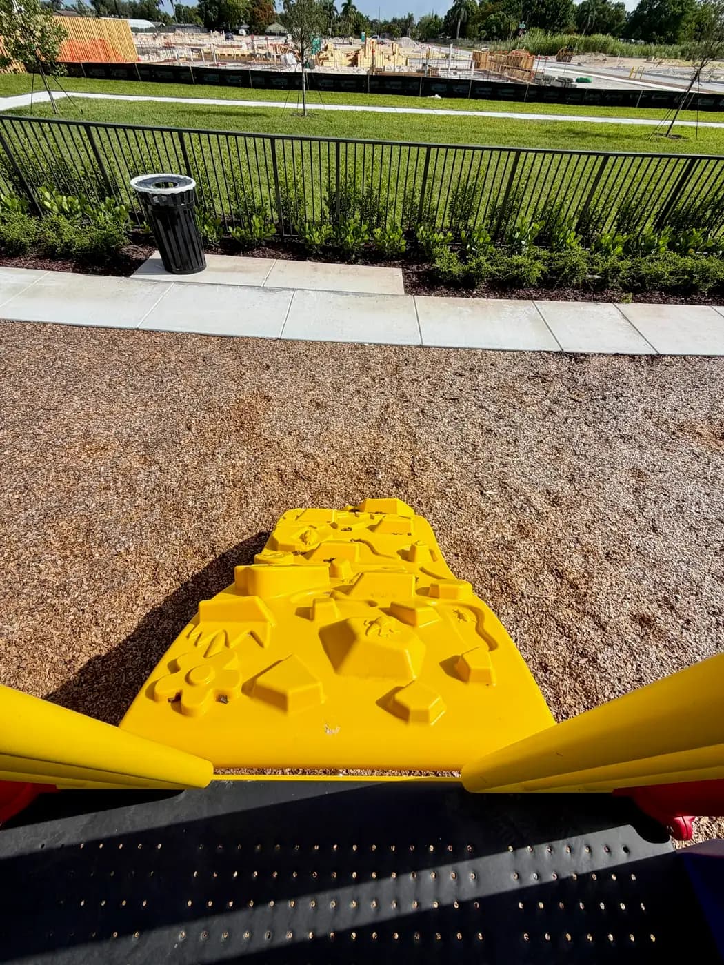 Landscaped beds beside the Coral Landings play area