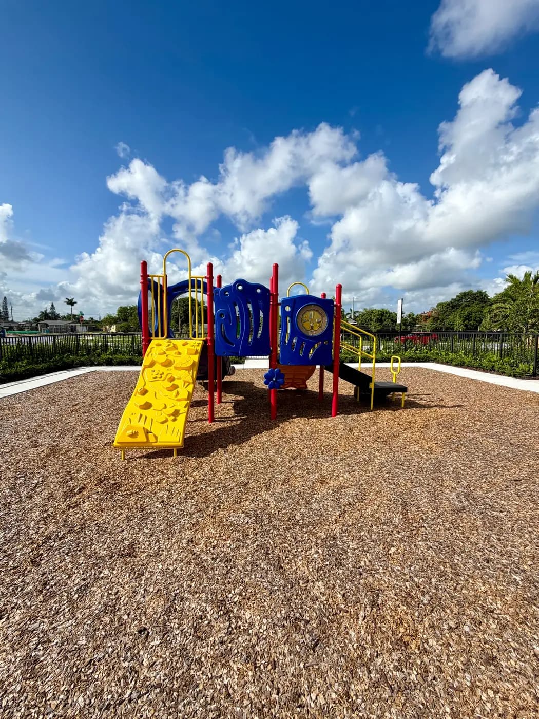 Coral Landings play system with yellow slide and climbing elements