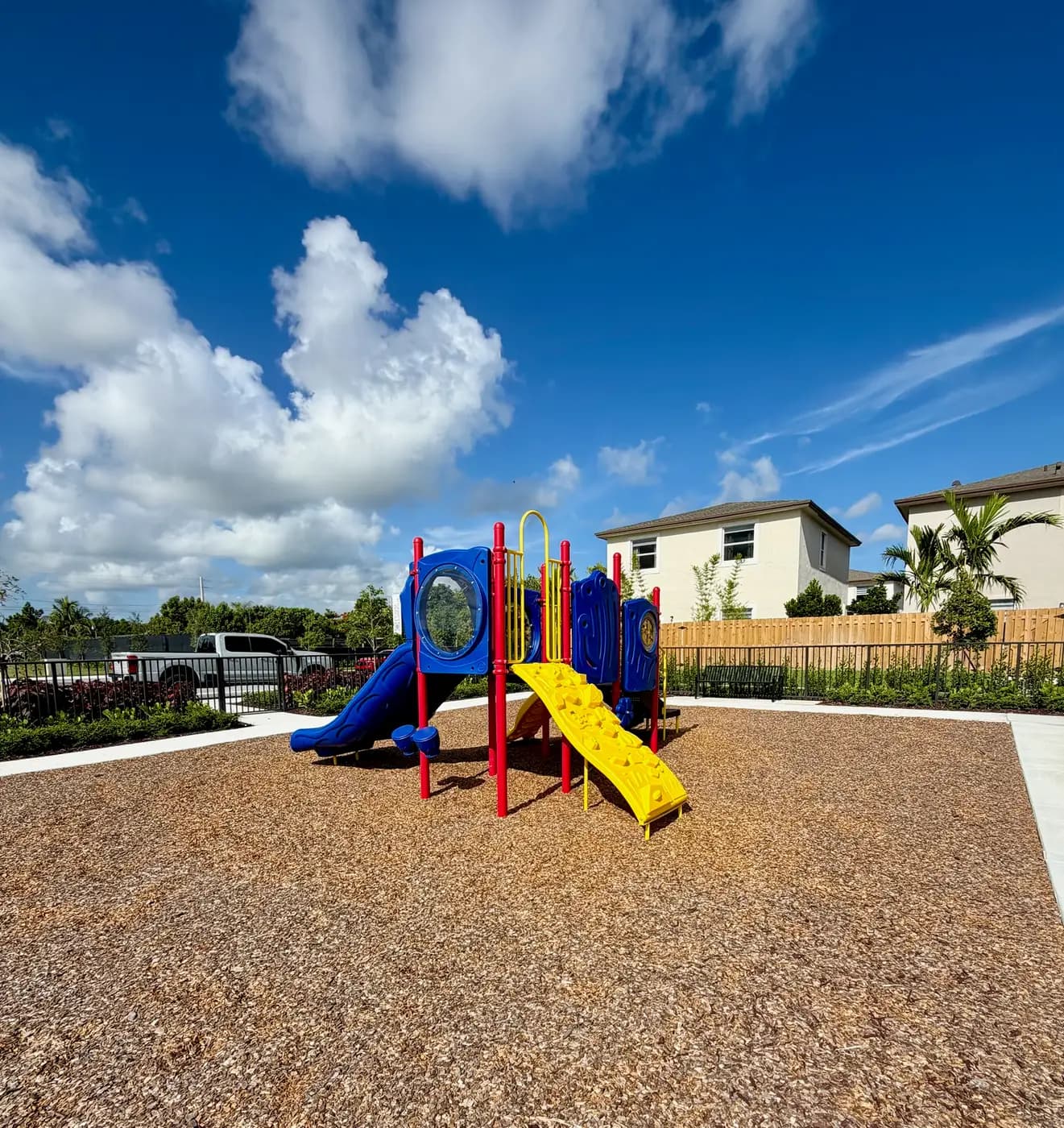 Coral Landings playground with the community buildings behind