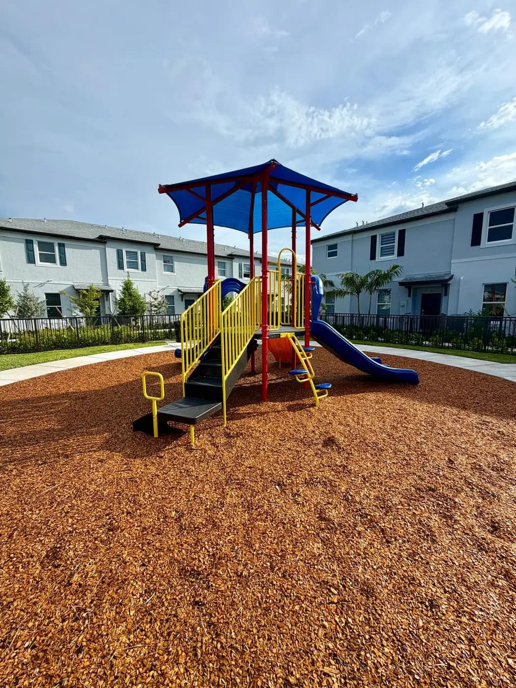 Play system with built-in blue shade roofs and twin slides
