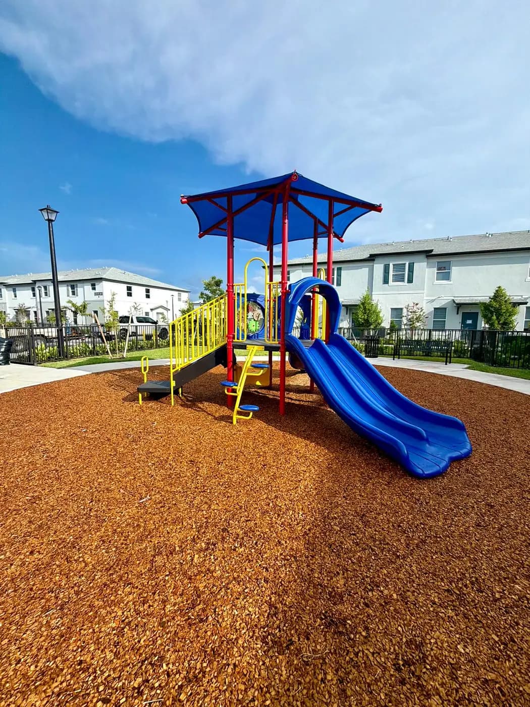 Twin blue slides on the Solstice play system