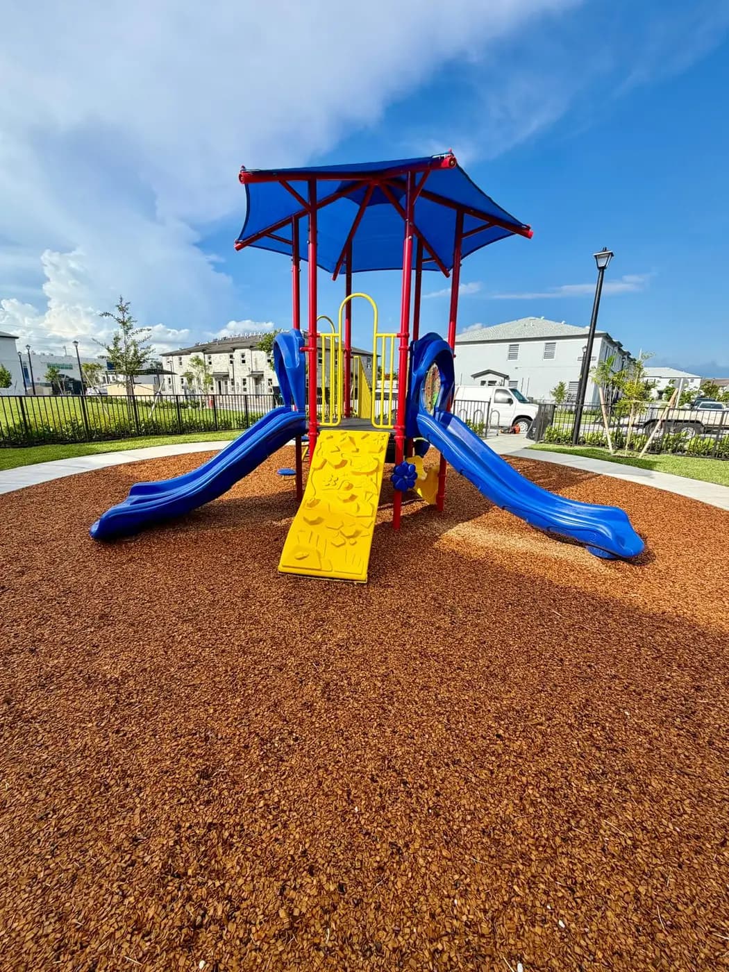 Yellow climber and blue slides at Solstice