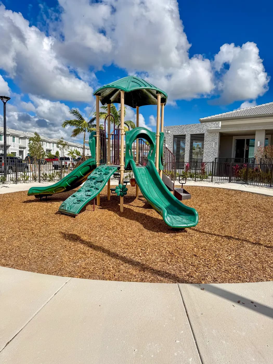 Terra Sol play structure in front of new community homes