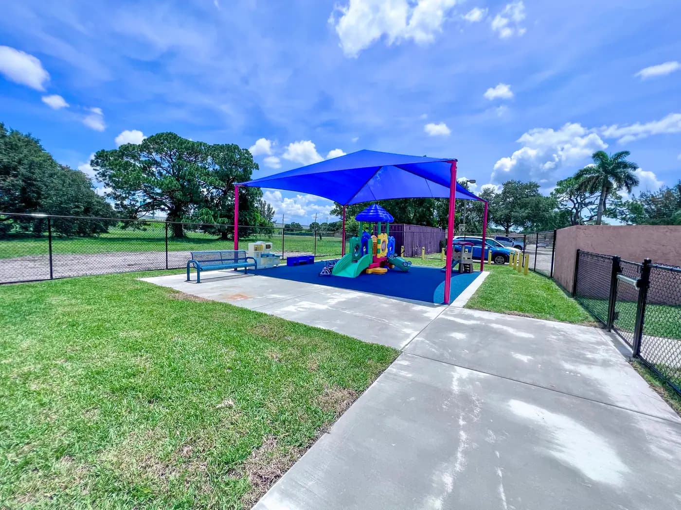 Shaded play area and walkway at the Universal Truth Center
