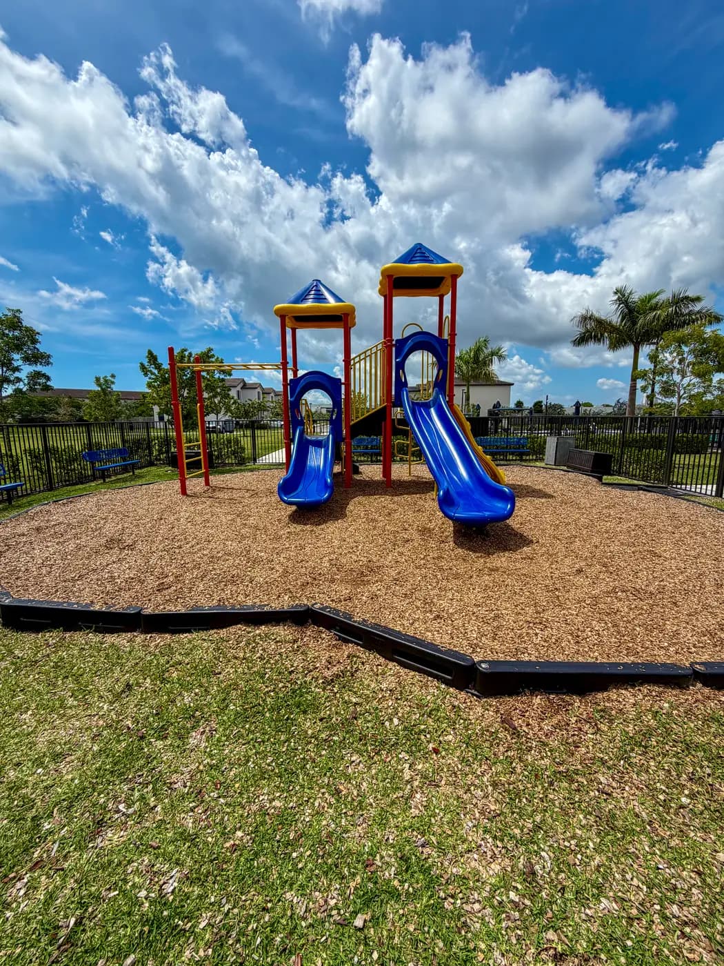 Blue slides and tube elements at the Siena Reserve playground