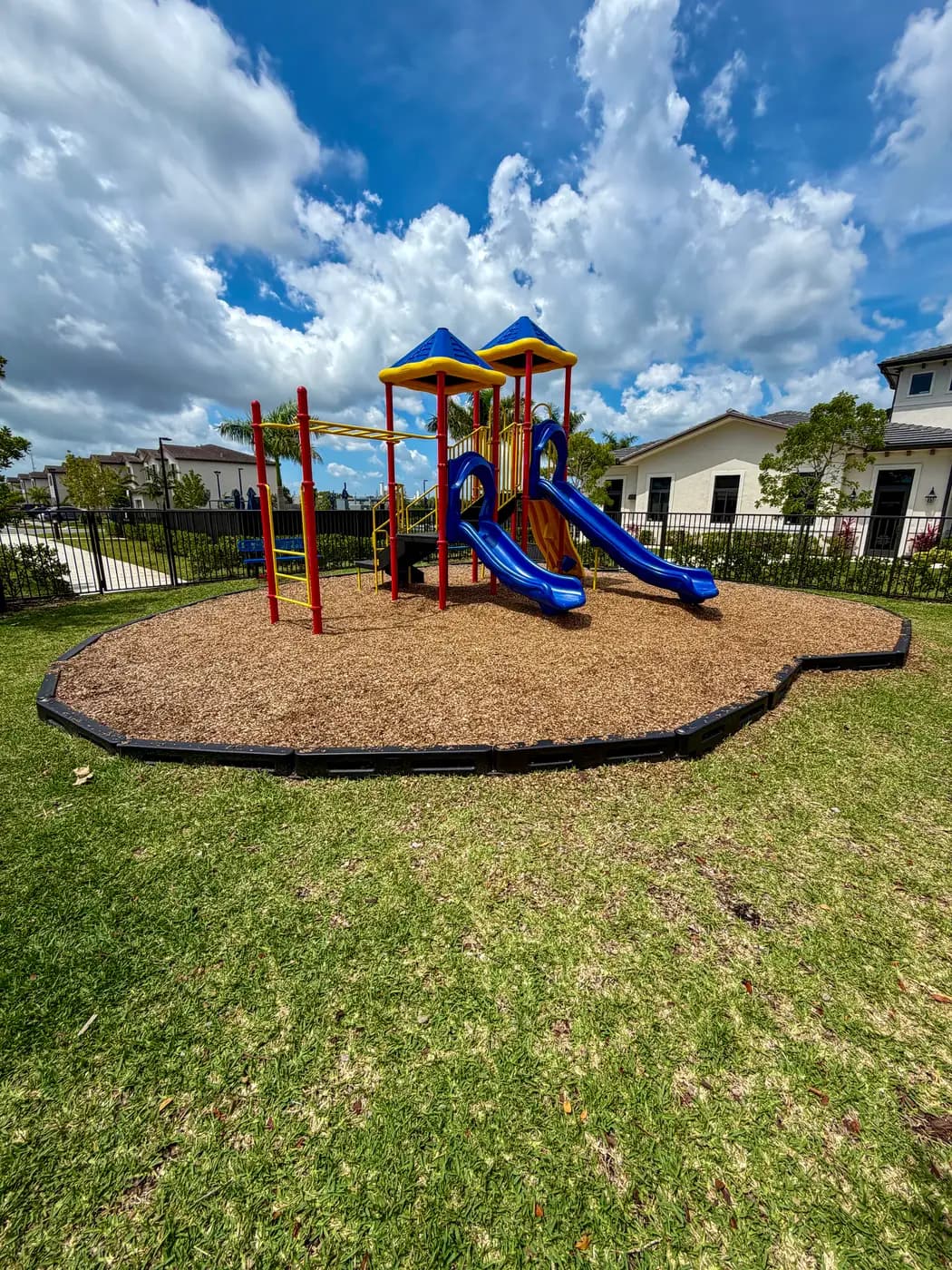 Siena Reserve play system with homes in the distance