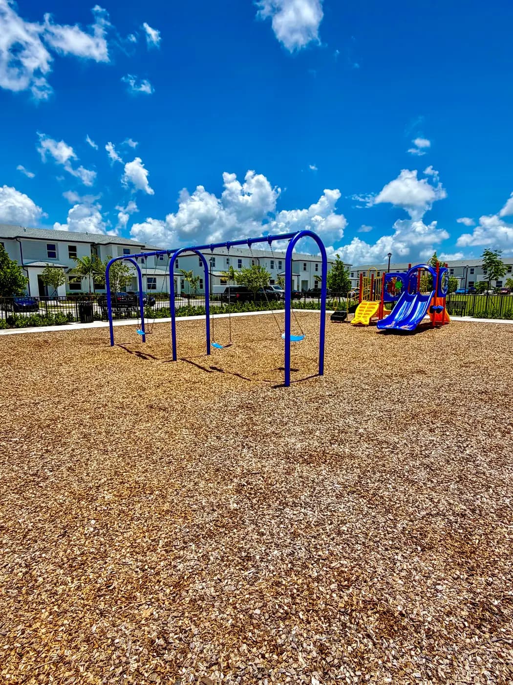 Swing bay and toddler slide unit at the Vivant Community park